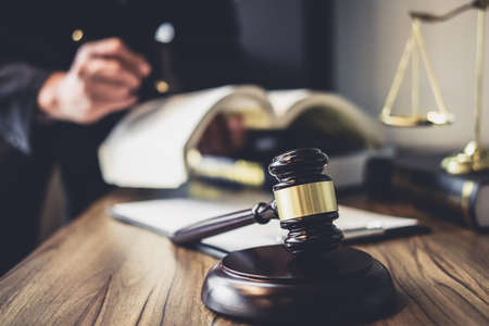 Judge gavel with Justice lawyers, Lawyer or Judge counselor working with agreement contract in...