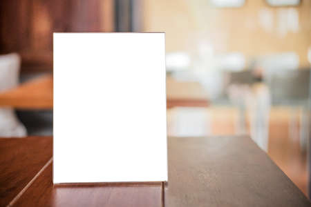 Mock up blank menu frame on table in coffee shop stand for your text of display your product.の写真素材