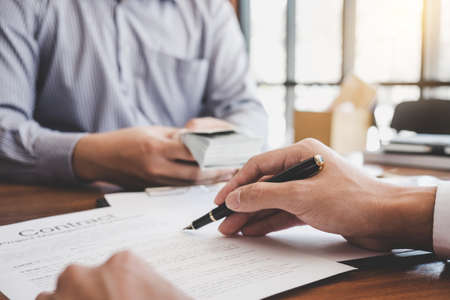 Home for rent concept, broker agent presenting and consult detail to customer to making the decision a home estate loan to customer sign form agreement, home model.の写真素材