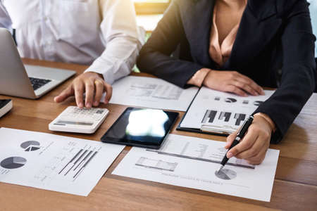 Young businessteam working with new startup project. discussing the charts and graphs showing the results at meeting. Business accounting and financial concept.の写真素材