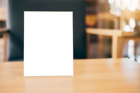 Mock up blank menu frame on table in coffee shop stand for your text of display your product.の写真素材