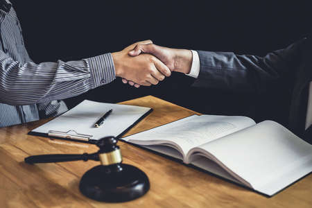 Handshake after good cooperation, Businessman Shaking hands with Professional male lawyer after...