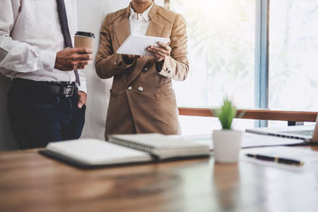 Business team colleague working and conference with new startup project plan and discussion information for financial strategy with digital tablet, results of their successful teamwork.の写真素材