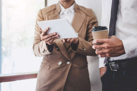 Business team colleague working and conference with new startup project plan and discussion information for financial strategy with digital tablet, results of their successful teamwork.の写真素材