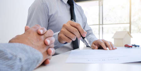 Car and Home insurance concept, broker agent presenting and consult to customer to decision making...