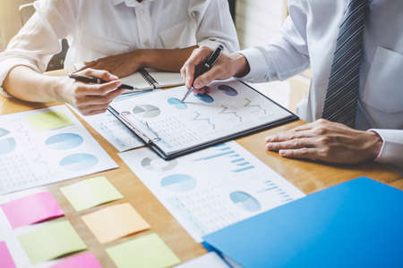 Co working conference, Executive team discussing the charts and graphs working in business strategy...