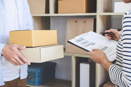 Shipment Online Sales, Small business or SME entrepreneur owner delivery service and working packing...