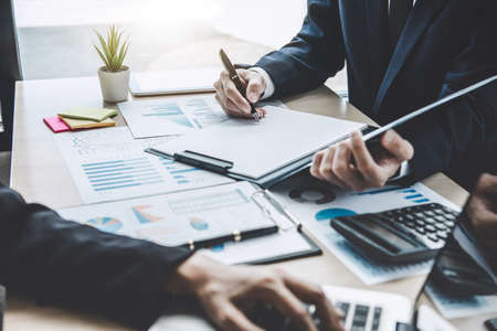 Finance manager meeting discussing company growth project success financial statistics, professional investor working start up project for strategy plan with document, laptop and digital tablet.の写真素材