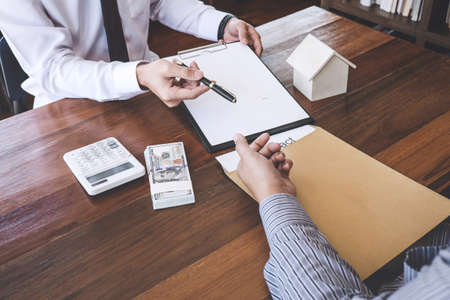 Home for rent concept, broker agent presenting and consult detail to customer to making the decision...