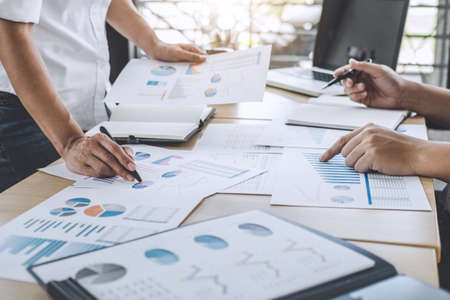 Business team meeting working with new startup project, discussion and analysis data the charts and graphs, laptop using, Business finances and accounting concept.の写真素材