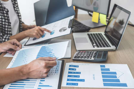 Business team meeting working with new startup project, discussion and analysis data the charts and graphs, laptop computer using, Business finances and accounting concept.の写真素材