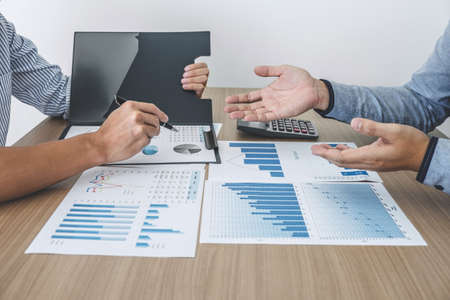 Finance manager presenting and discussing company growth project success financial statistics, professional investor working start up project for strategy plan with document.の写真素材