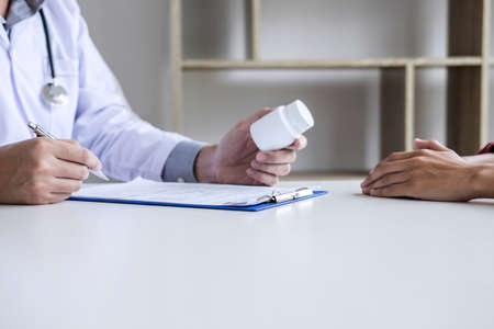 Medicine and health care concept, Professor Doctor presenting report and recommend a method with patient treatment, after results about the problem of the patient.の写真素材