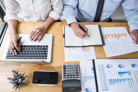 Business team are working with leader, Presentation to colleagues and business strategy and having a discussion, pointing to the graph and chart, success of cooperation partnership.の写真素材