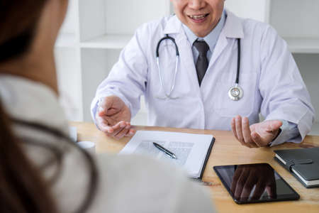 Medicine and health care concept, Professor Doctor presenting report of diagnosis and recommend something a method with patient treatment, after results about the problem  illness of patient.の写真素材