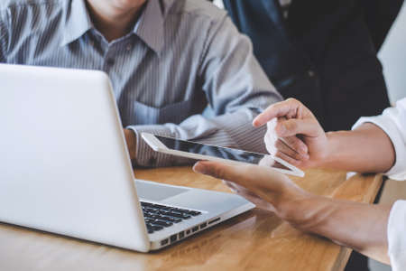 Startup business people group meeting, Business team meeting working with new startup project, discussion and analysis data the charts and graphs, professional business team.の写真素材