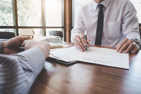 Business Signing a Contract Buy - sell house, Man sign a home insurance policy on home loans,...