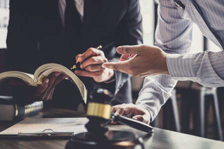 Good service cooperation, Consultation of Businessman and Male lawyer or judge counselor having team meeting with client, Law and Legal services concept.の写真素材