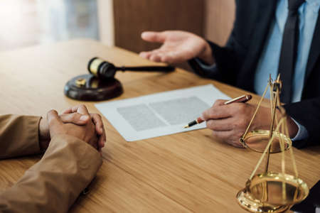 Marriage divorce on Judge gavel deciding, Consultation between a Businesswoman and Male lawyer or...