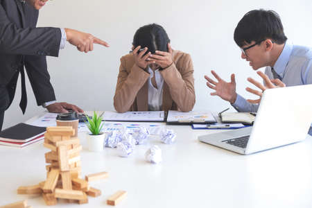 Blaming business concept, Senior and Female ceo executive manager blaming employee for mistake or failure, business team have disagreement in office arguing on work issues.の写真素材