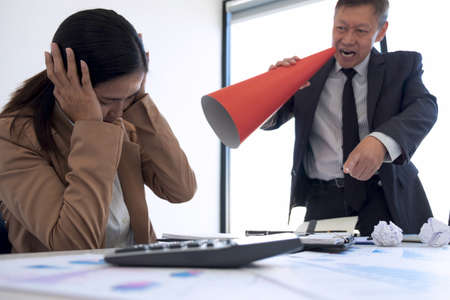 Blaming business concept, Senior executive manager blaming employee for mistake or failure, business team have disagreement in office arguing on work issues.の写真素材