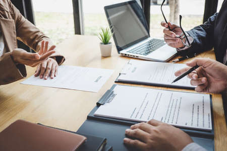 Business woman explaining about his profile to two selection committee manager sitting in during job Interview, interview the job and hiring.の写真素材