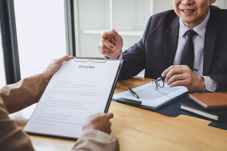 Job interview, Senior selection committee manager asking questions to applicant about work history, colloquy dream,  Skill, expertise, experience and businessman listen to candidate answers.の写真素材