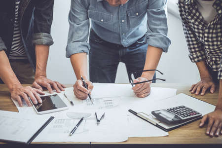 Architecture Engineer Teamwork Meeting, Drawing and working for architectural project and engineering tools on workplace, concept of worksite on technical drawing structure and construction.の写真素材