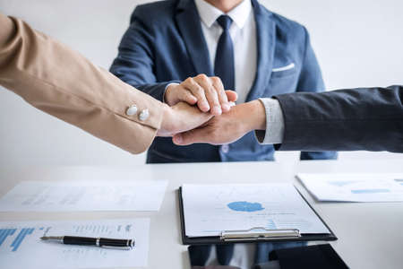 Image of business people joining and putting hands together during their meeting, connection and collaboration concept, Teamwork process of partner and best relationship.の写真素材