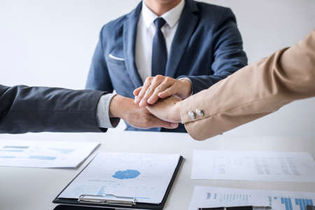 Image of business people joining and putting hands together during their meeting, connection and collaboration concept, Teamwork process of partner and best relationship.の写真素材