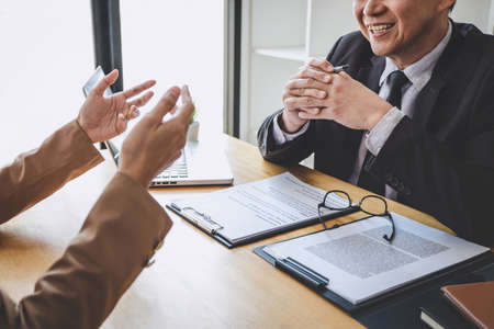 Job interview, Senior selection committee manager asking questions to applicant about work history,...