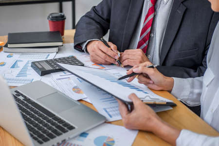 Partner meeting of business team colleagues consultation and discussion marketing plan meeting concept on financial report and analyzing investment project to development grow to success.の写真素材