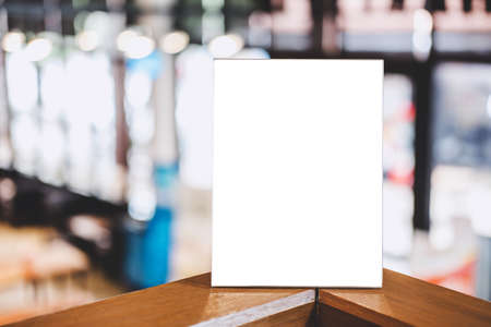Mock up acrylic frame posters pattern template forms background, blank menu frame on table in coffee shop or restaurant stand for your text of display your product.の写真素材