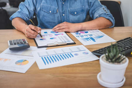 Business Financing Accounting Banking Concept, businessman doing finances and calculate about cost to real estate investment and in other, tax system.の写真素材