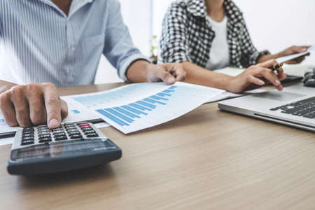 Business team meeting working with new startup project, discussion and analysis data the charts and graphs, laptop computer using, Business finances and accounting concept.の写真素材