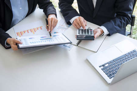 Business team colleagues discussing working analyzing with financial data and marketing growth report graph in team consultation to grow up profit, Meeting Talking Brainstorming Communication Concept.の写真素材