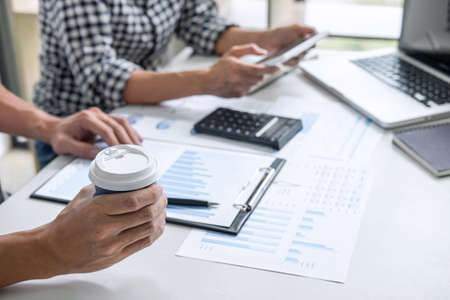 Teamwork of business casual colleagues, consultation new strategy plan business and market growth on...