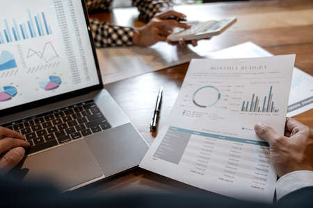 Teamwork of business colleagues, consultation new strategy plan business and market growth on financial document graph report, conference to making growth profit, Partner meetings and briefing.の写真素材