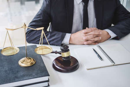 Judge gavel with Justice lawyers, Counselor in suit or lawyer working  with contract papers on a...