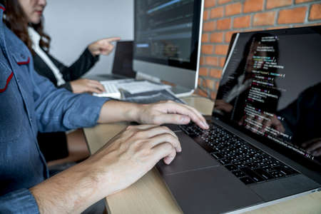 Programmers cooperating at Developing programming and website working in a software develop company...