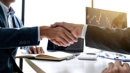 Teamwork partnership meeting concept, Two confident Business shaking hands after discussing good...