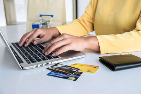 Woman using credit card register security code payments online shopping and customer service network connection market, using technology on laptop, Internet Online shopping or banking concept.の写真素材
