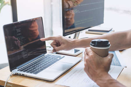 Programmers cooperating at Developing programming and website working in a software develop company...