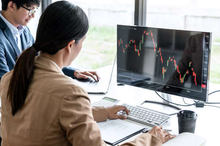Business team investment working with computer, planning and analyzing graph stock market trading with stock chart data, business financial investment and technology concept.の写真素材