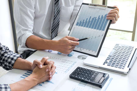 Business team meeting working with new startup project, discussion and analysis data the charts and...