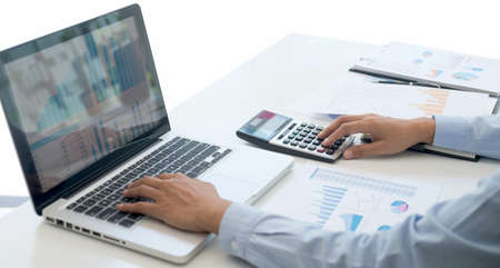 Professional at work, business woman working and analyzing on laptop with calculate statistics of...