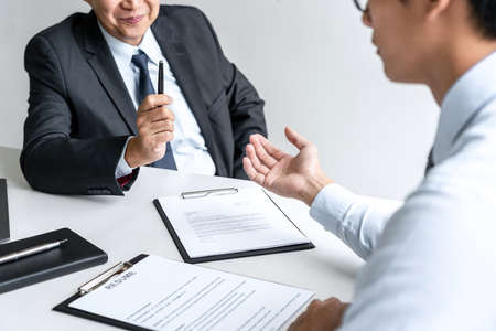 Job interview, Senior selection committee manager asking questions to applicant about work history, colloquy dream,  Skill, expertise, experience and businessman listen to candidate answers.の写真素材