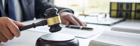 Judge gavel with Justice lawyers, Businessman in suit or lawyer working on a documents in courtroom....