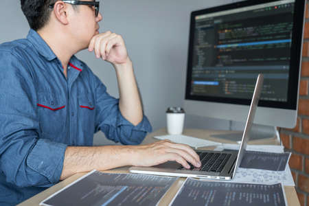 Young Professional programmer working at developing programming and website working in a software...