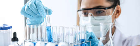 Scientist or medical in lab working in biotechnological laboratory using equipment for research with...